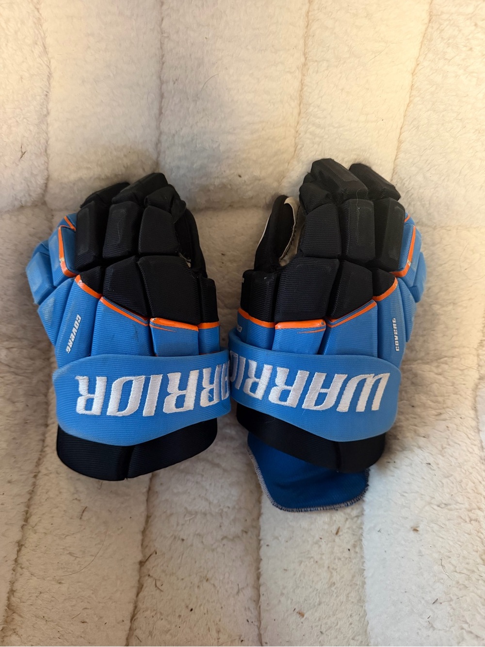 Warrior Blue and Black Hockey Gloves